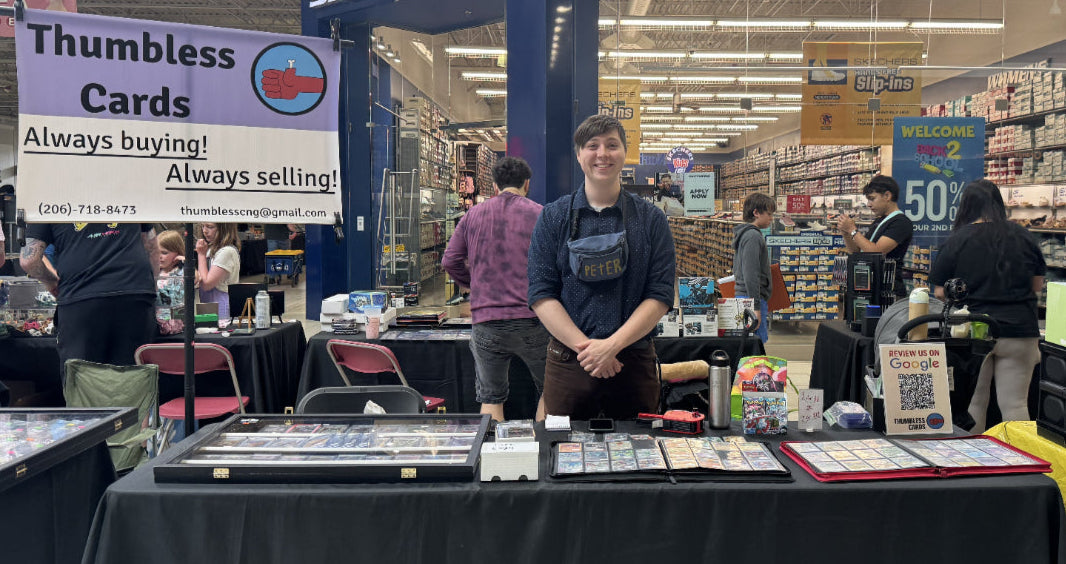 Person standing behind a table with various items at a Skechers store event.